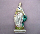 Pearlware figure of a poacher standing by a tree trunk